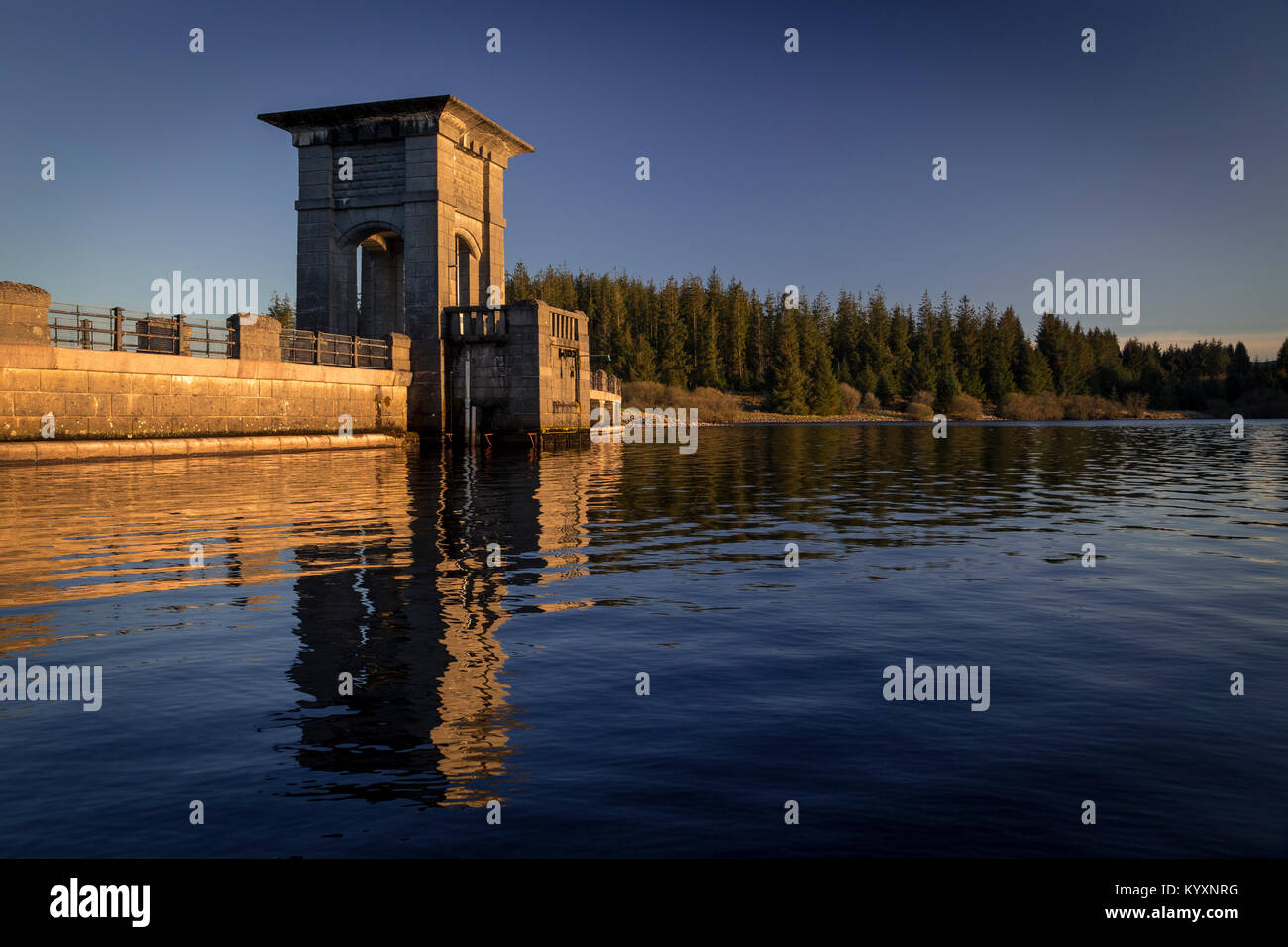 The dam at Alwen reservoir , North Wales, with reflection Stock Photo