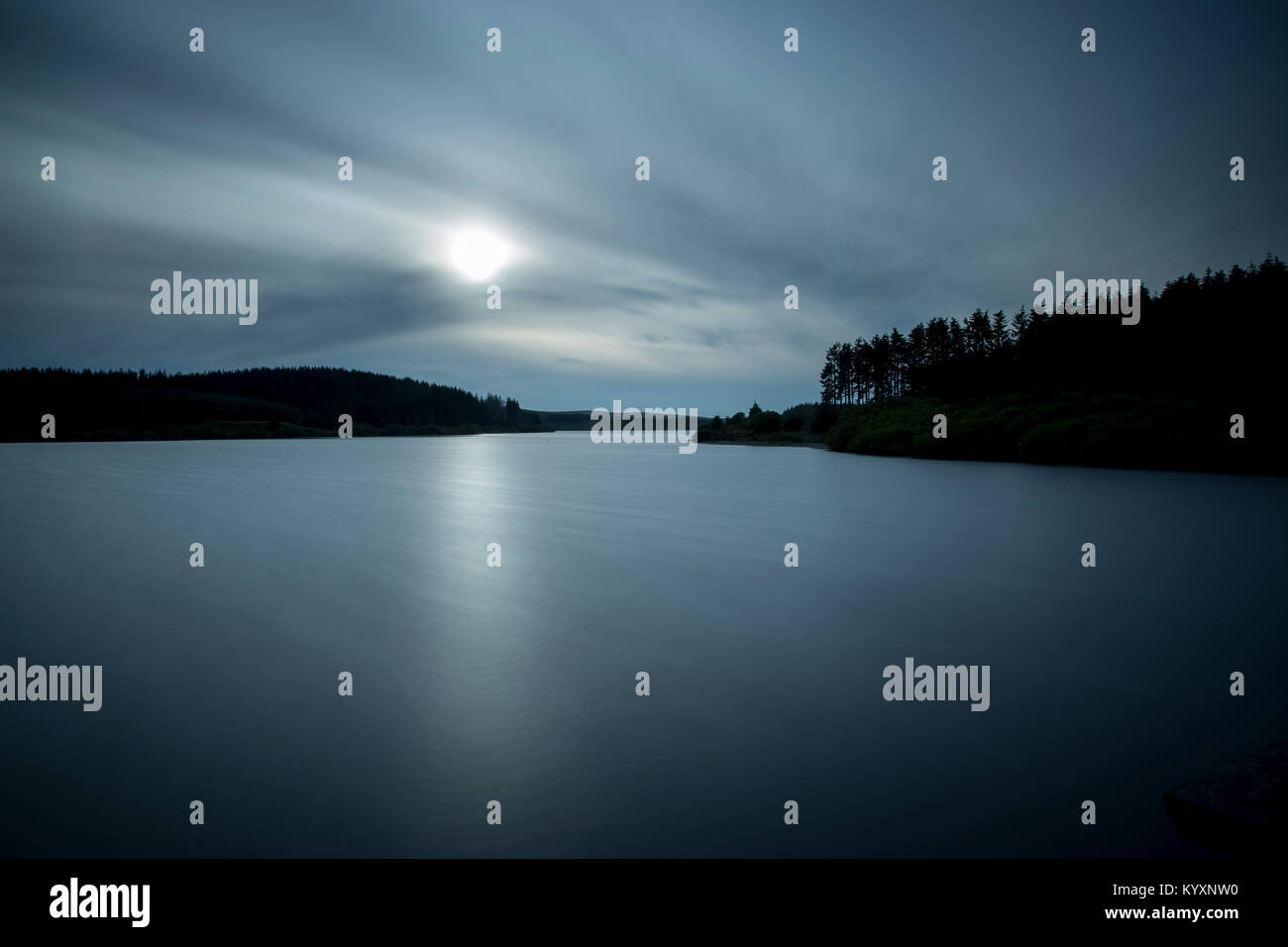 Sunlight shining through cloud cover over the waters of Alwen Reservoir in mid-Wales Stock Photo