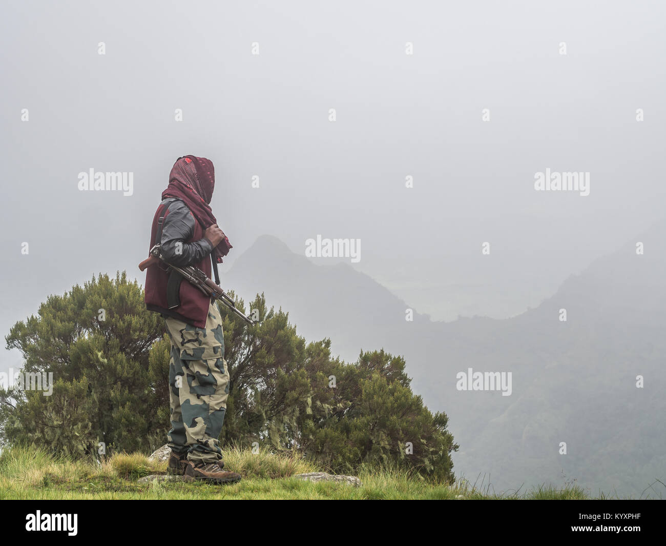 A man carring a kalashnikov in Semien mountains, Ehtiopia. Stock Photo