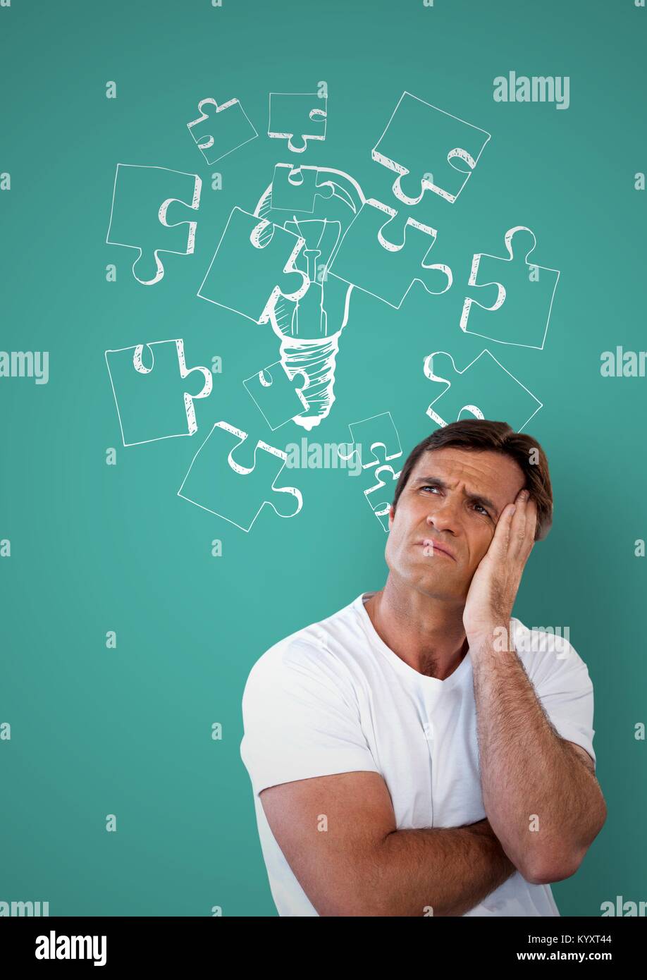 Confused man frowning and holding his head looking up and a drawing Stock Photo Alamy