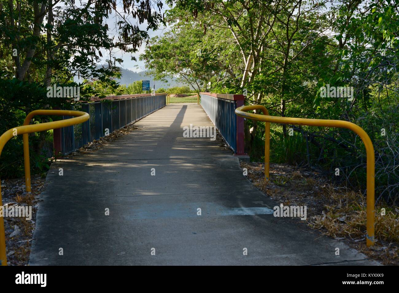 Footbridge crossing a backwater of the Ross River, Annandale, Townsville, Queensland, Australia Stock Photo