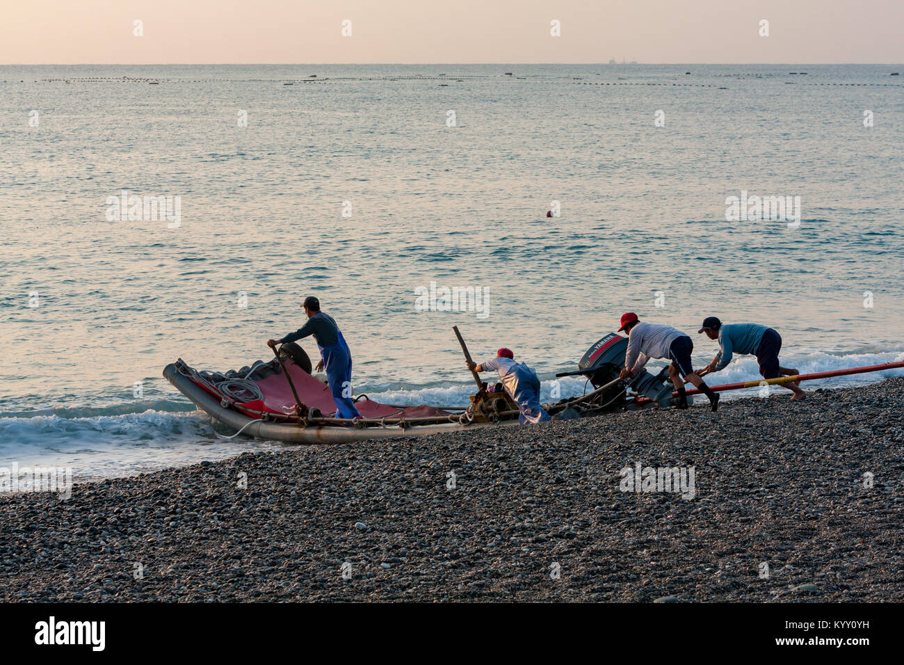 Pushing Raft Local fishermen pushing their plastic raft into the sea in the early ...