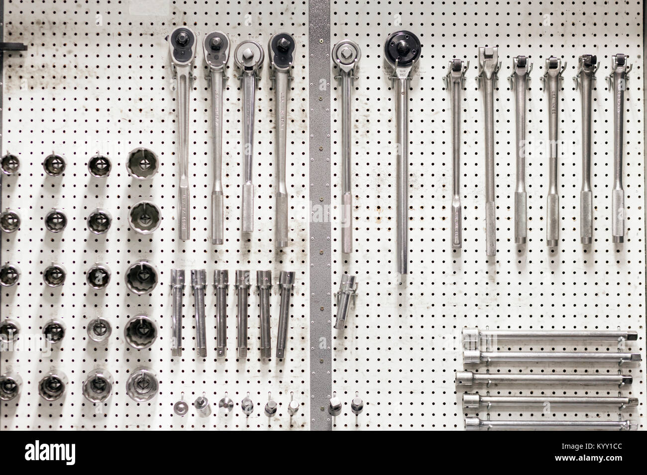 Closeup of work tools hanging on pegboard Stock Photo Alamy