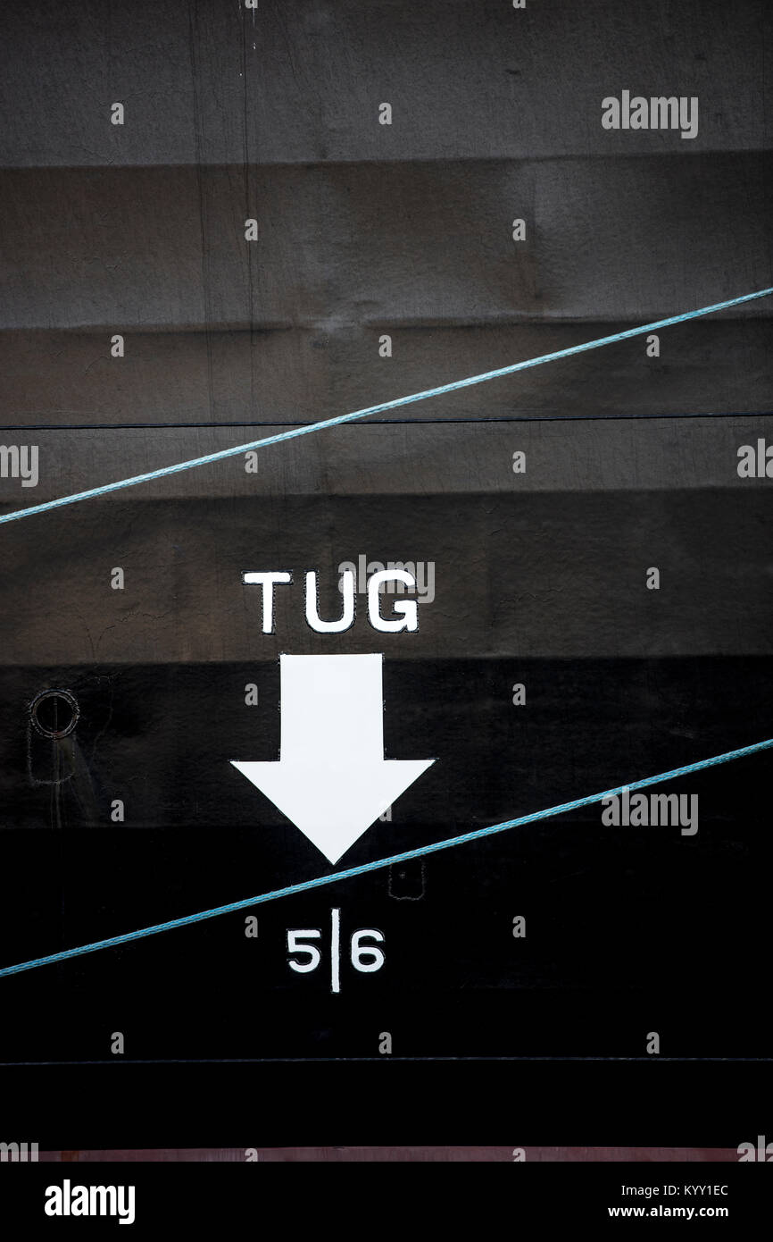 Close-up of tug text with arrow symbol on boat Stock Photo