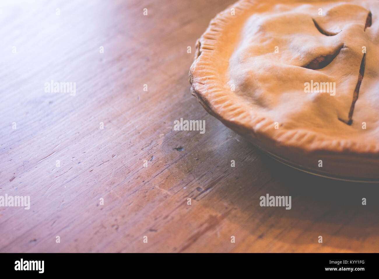 High angle view of apple pie on wooden table Stock Photo