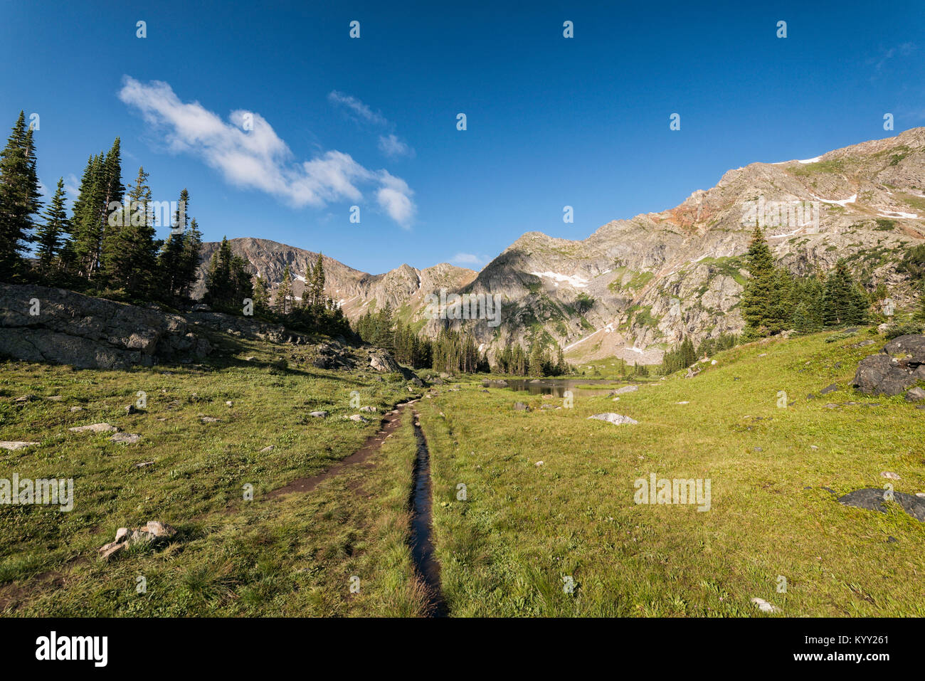 Landscape by mountains at White River National Forest against sky Stock