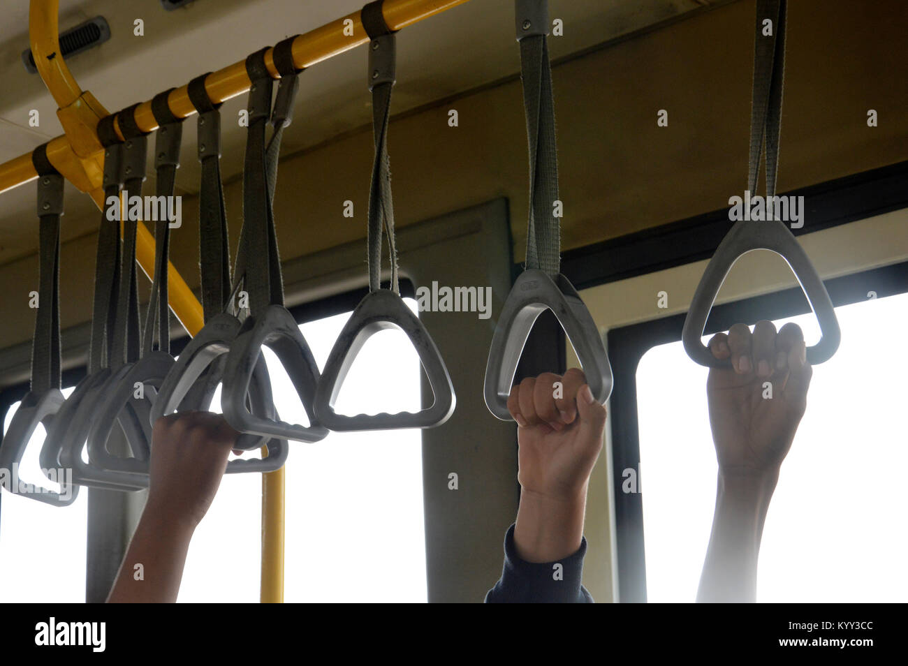 strap hangers on the bus Stock Photo Alamy