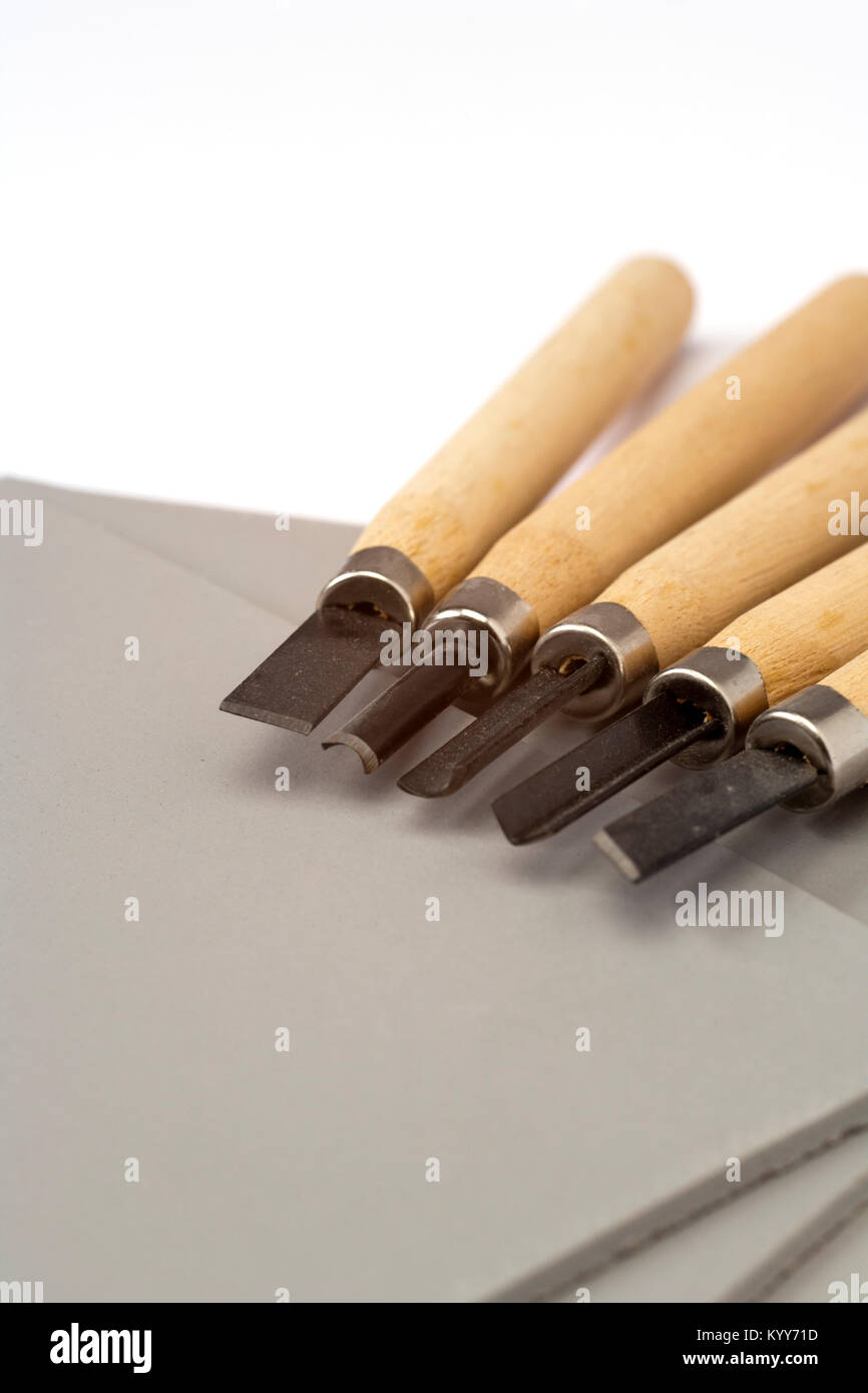Art and crafts - linocut tools on white paper Stock Photo - Alamy
