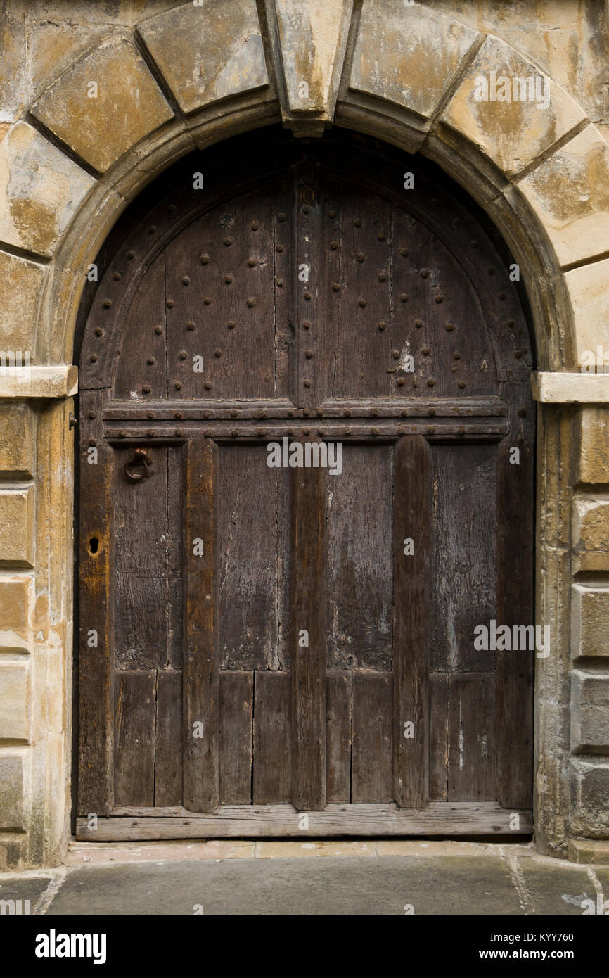 An ancient studded wood entrance door Stock Photo - Alamy