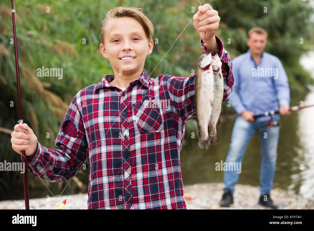 Teenage boy fishing forest lake hi-res stock photography and images - Alamy