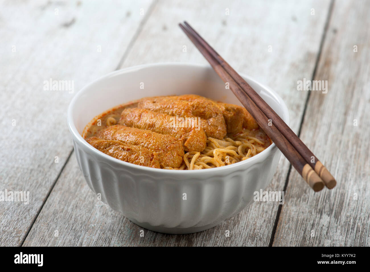 Hot and spicy Curry Noodles with chopsticks. A popular traditional