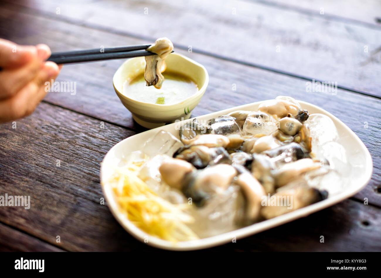 wasabi and fresh Oysters on the table Stock Photo