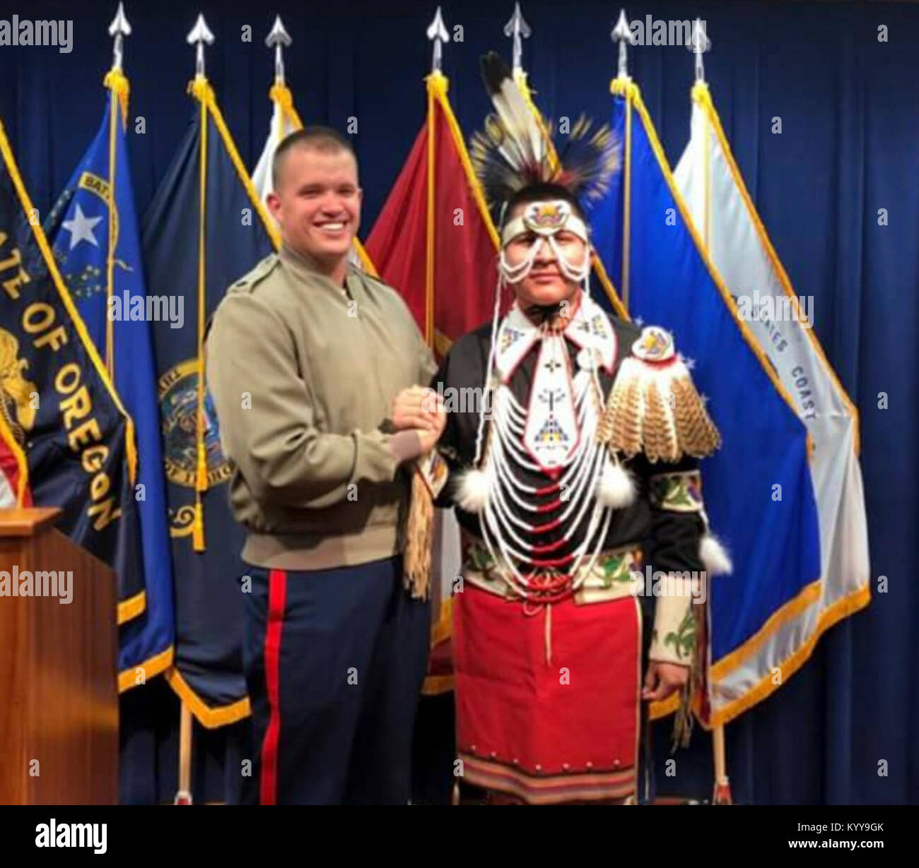 Devin Nagitsy, future marine from Fort Hall, Id., poses with his recruiter Sgt. Shane Mason, recruiter at Recruiting Sub Station Idaho Falls. Nagitsy is enlisted in the Shoshone-Bannock tribes of southeastern Idaho and has bloodlines of four tribes; Northern Cheyenne, Eastern Shoshone, Shoshone-Bannock and Navajo. He will leave for Marine Corps Recruit Depot for recruit training on Jan. 16, 2018. Stock Photo