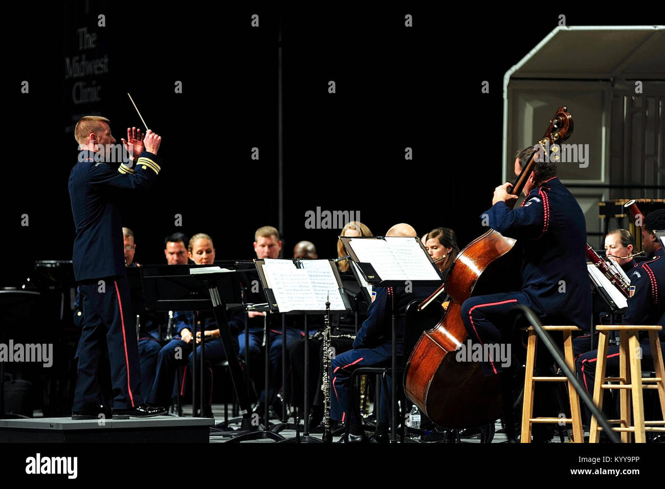 Lt. Cmdr. Adam Williamson conducts the Coast Guard Band during a