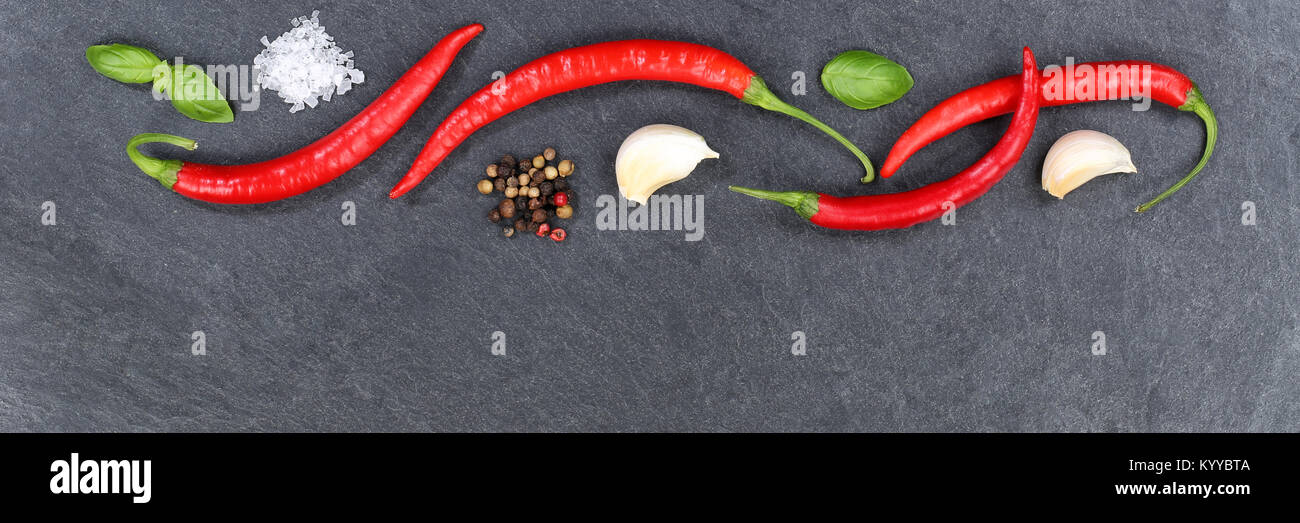 Red hot chili peppers chilli cooking ingredients copyspace banner slate top view from above Stock Photo