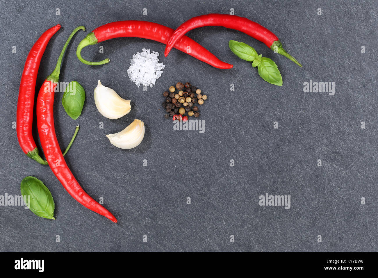 Red hot chili peppers chilli cooking ingredients copyspace slate top view from above Stock Photo