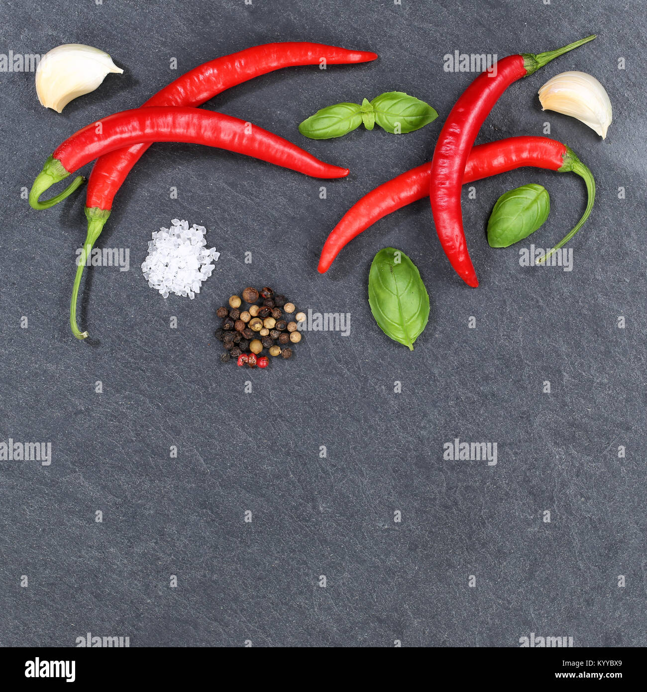 Red hot chili peppers chilli cooking ingredients square copyspace slate top view from above Stock Photo