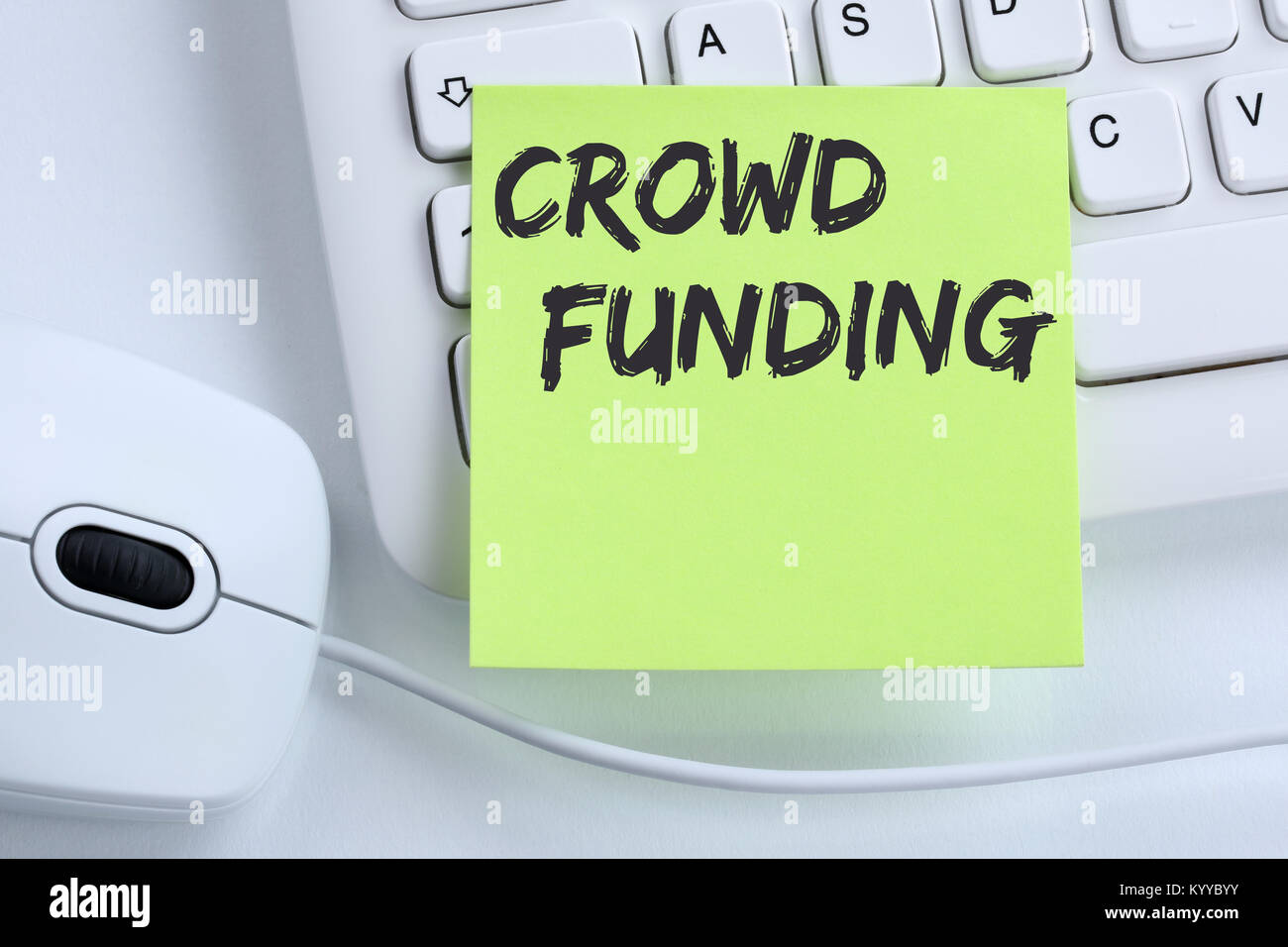 Crowd funding crowdfunding collecting money online investment internet business concept mouse desk computer keyboard Stock Photo