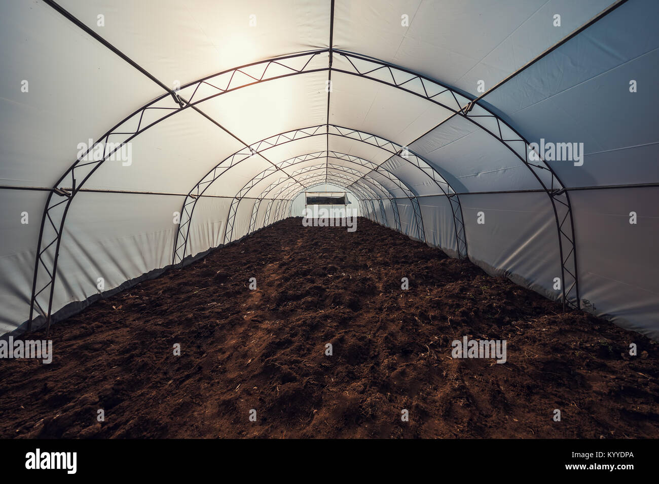 Inside view of greenhouse ready for planting. Stock Photo
