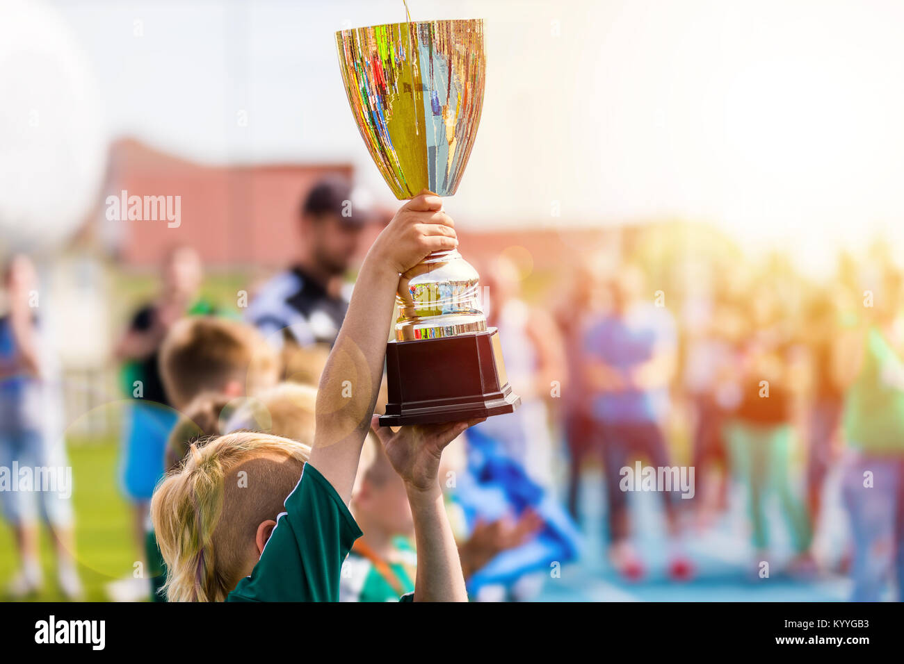Young Athlete Holding Trophy. Youth Sport Soccer Team with Trophy. Boys Celebrating Sports Achievement. Winning Team of Sport Tournament for Kids. Chi Stock Photo