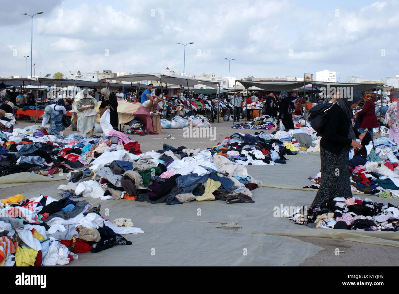 Tunisian women shopping for clothes in Monastir flea market, Monastir, Tunisia Stock Photo
