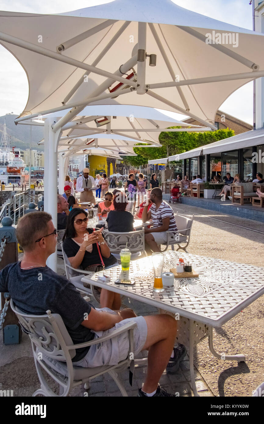 People at street cafes along the V&A Waterfront, Cape Town, South Africa Stock Photo