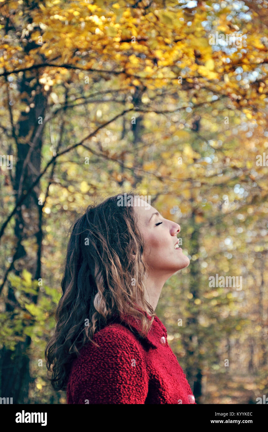 Outdoor portrait of young adult woman with eyes closed Stock Photo - Alamy