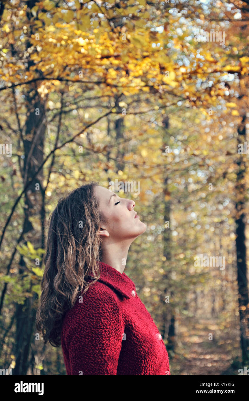 Outdoor portrait of young adult woman with eyes closed Stock Photo - Alamy