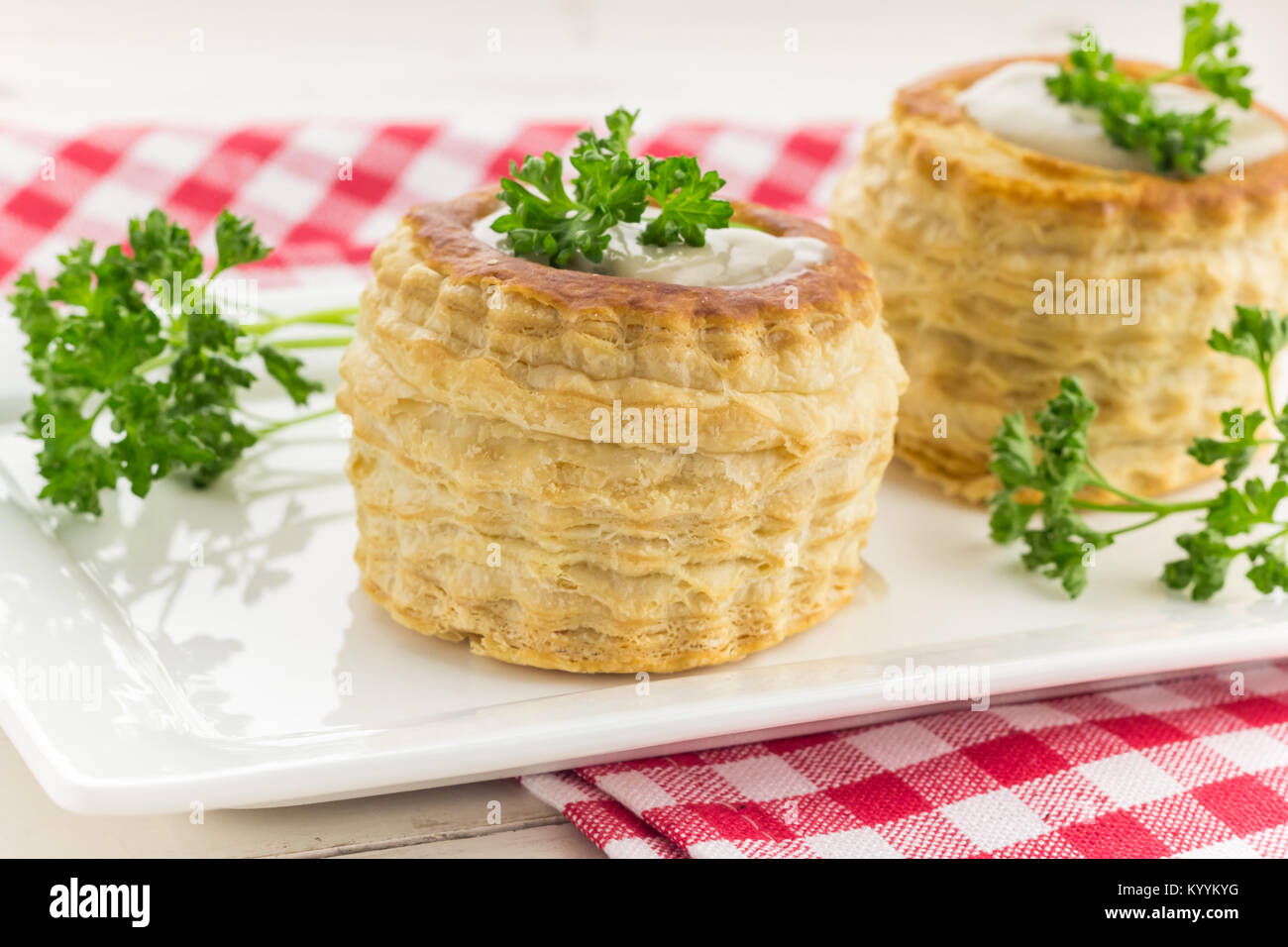 Puff pastry volauvents filled with mushroom ragout, topped with fresh
