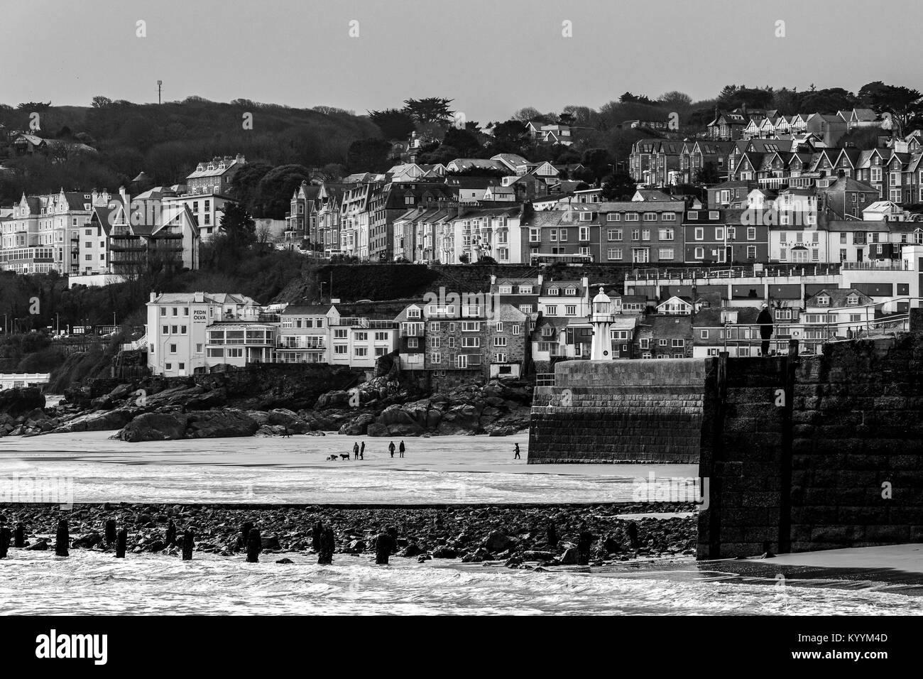 St Ives, Cornwall, UK, 16/01/2018.  Editorial: Unknown people walking along the beach at St Ives Stock Photo
