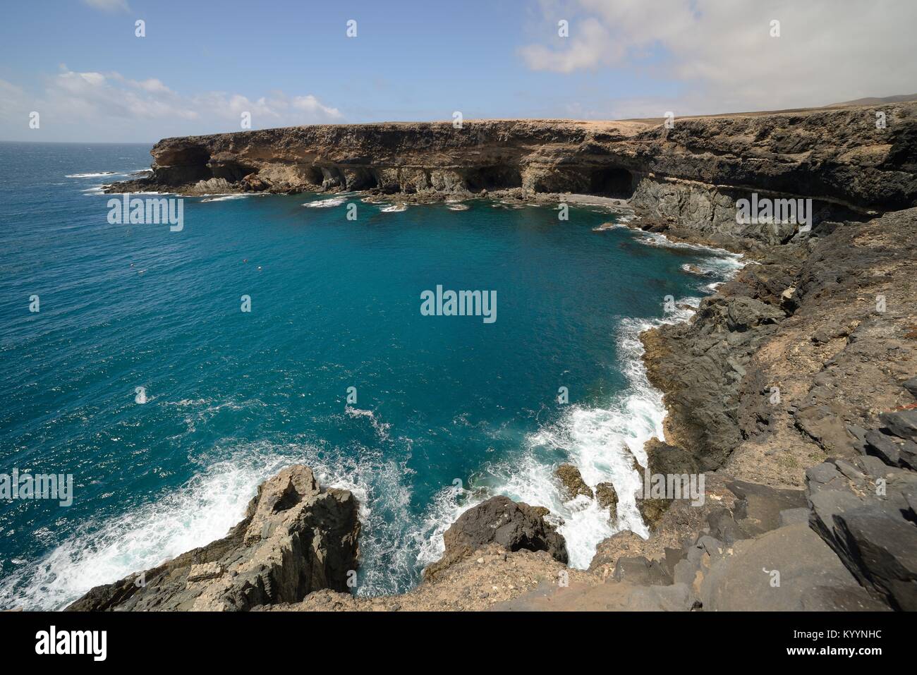 Overview of the Black Cove / Caleta Negra surrounded by eroded volcanic rock cliffs, Natural Monument of Ajuy (Peurto de la Pena), Fuerteventura. Stock Photo