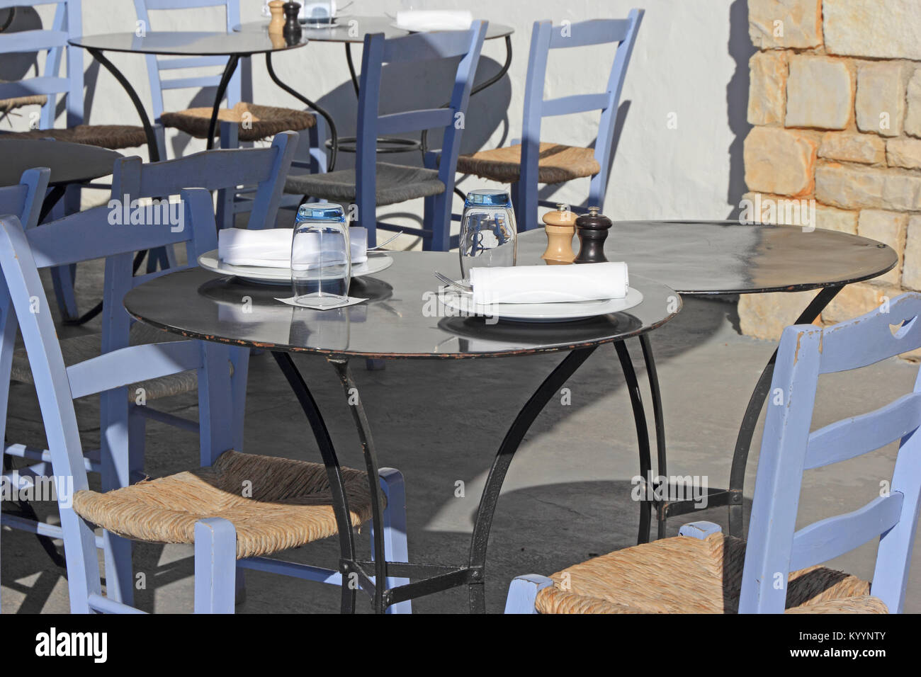 Tables set at outdoor café Stock Photo