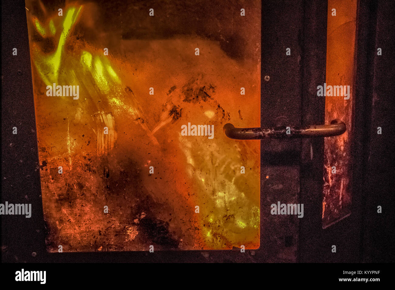 A close-up of a retro furnace with a burning fire Stock Photo