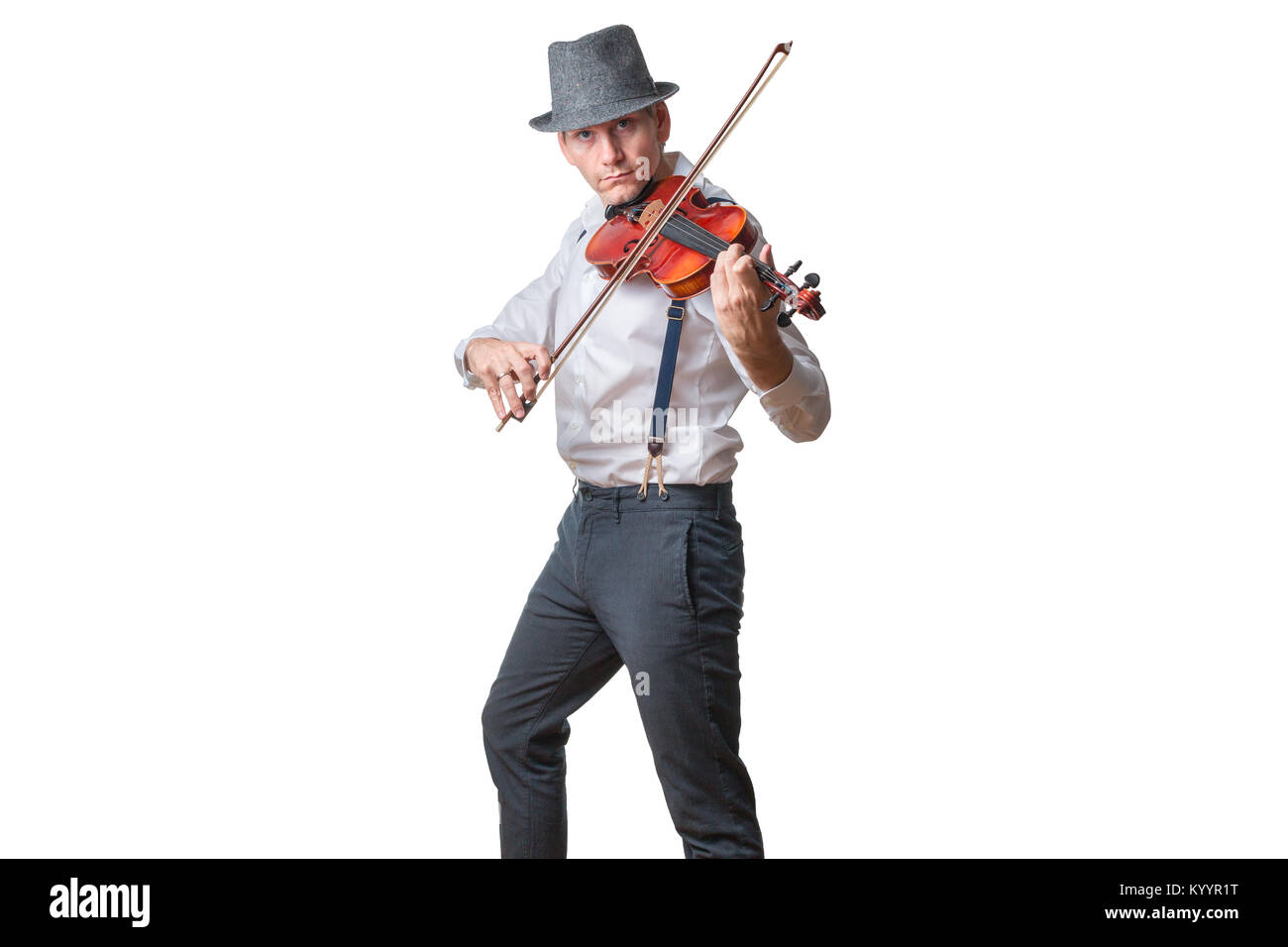 Man with hat plays the violin Stock Photo