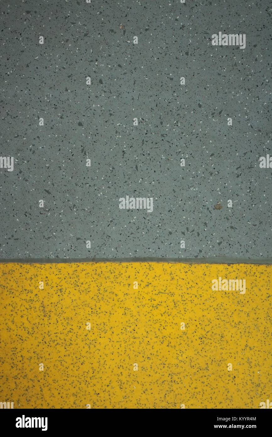 Yellow and grey safety flooring Stock Photo - Alamy