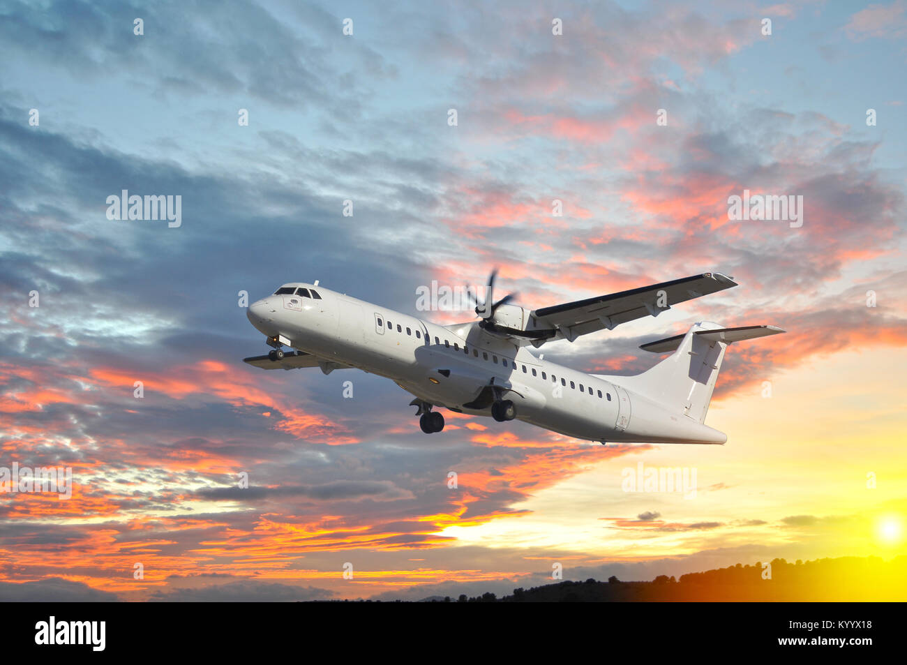Airplane in the sky at sunset, red sky Stock Photo - Alamy