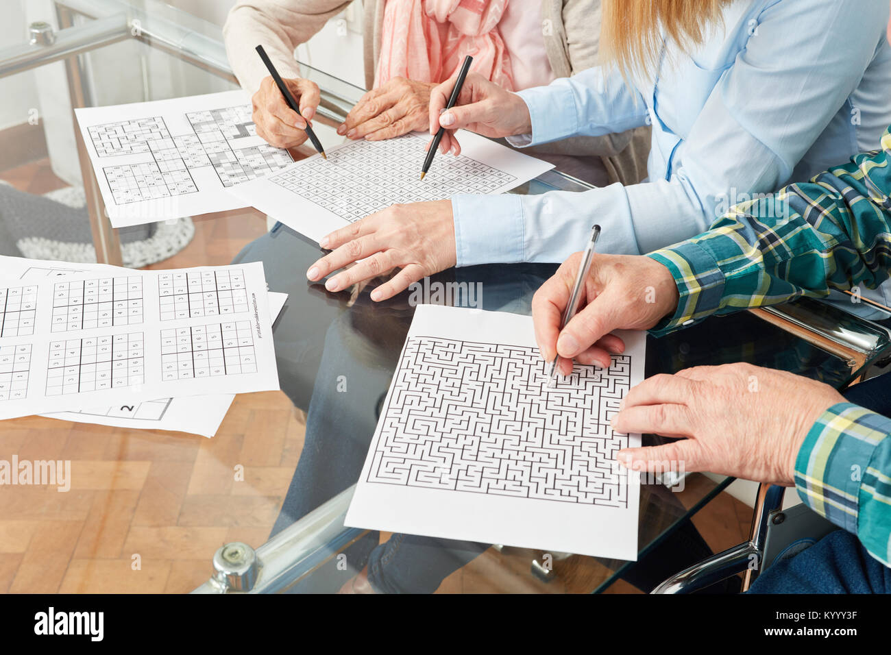 Seniors do memory training with maze against dementia disease Stock
