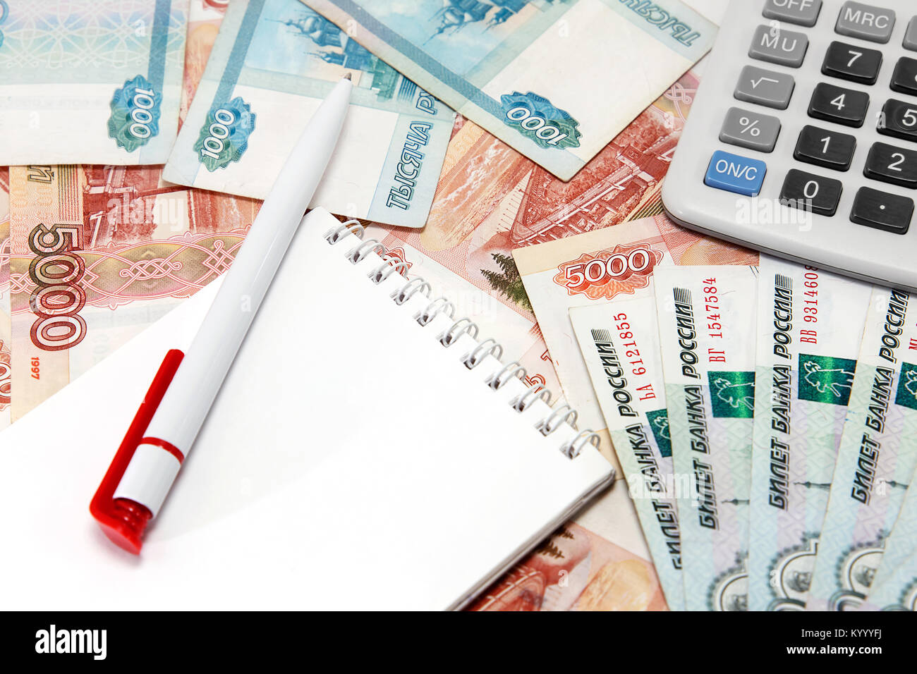 A lot of money, note pad, pen and calculator Stock Photo Alamy