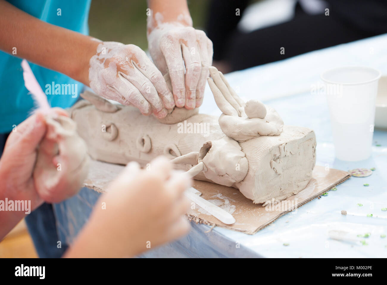 children making a clay sculpture Stock Photo