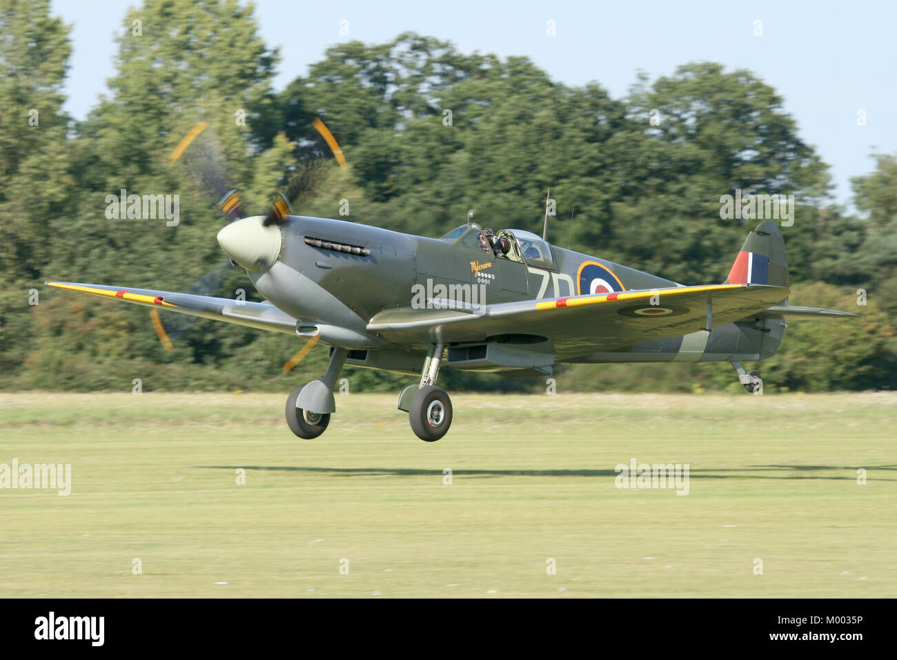 The Old Flying Machine Companies vintage MkIX Supermarine Spitfire taking off during a air display at the historic old airfield of Rougham, Suffolk. Stock Photo
