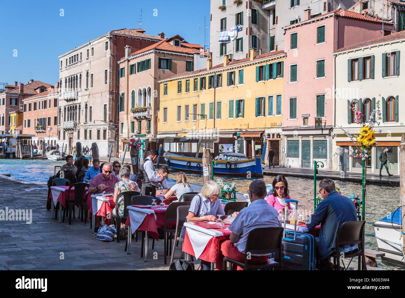 A canal-side restaurant in Veneto, Venice, Italy, Europe. Stock Photo