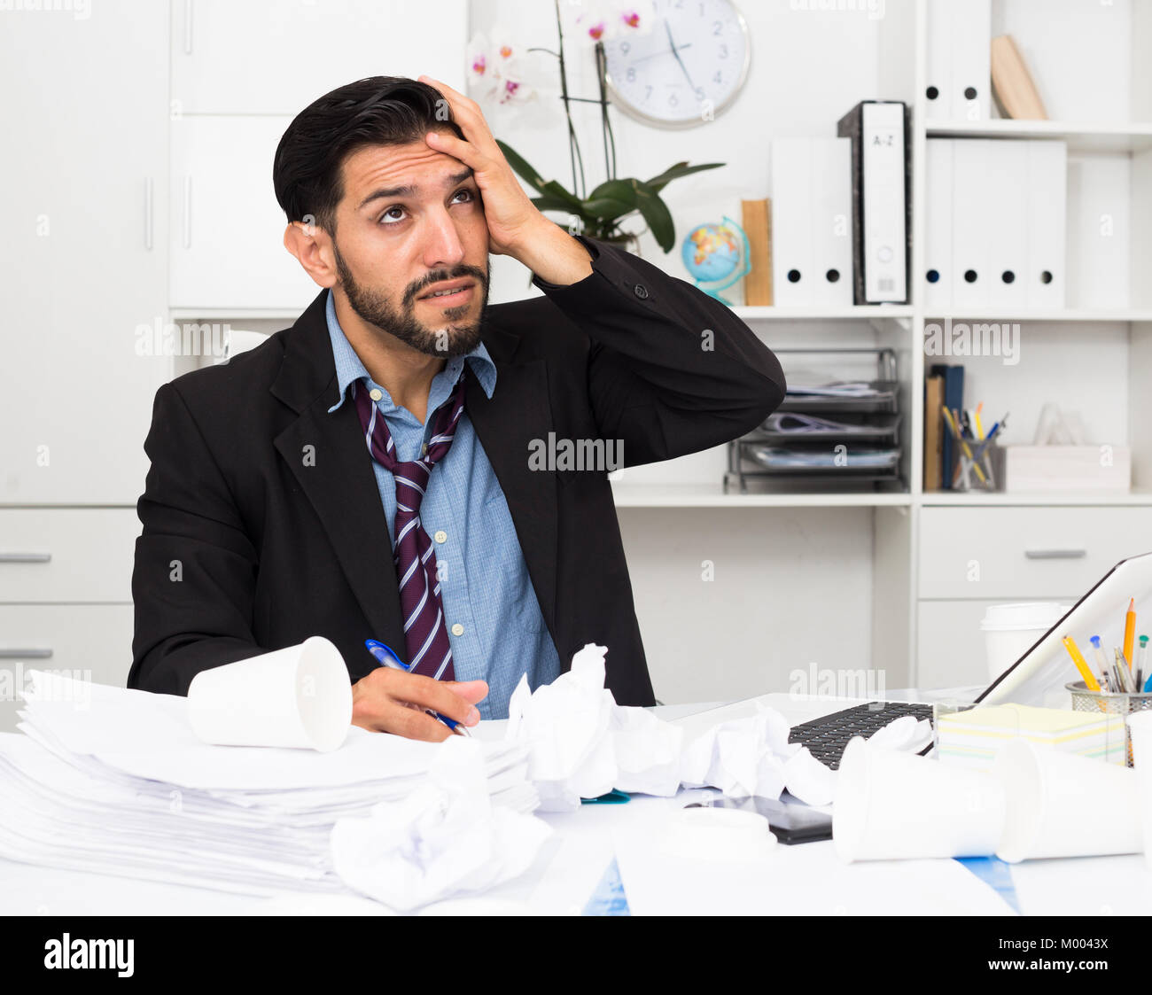 Man employee is indignant because he is having issues with project in