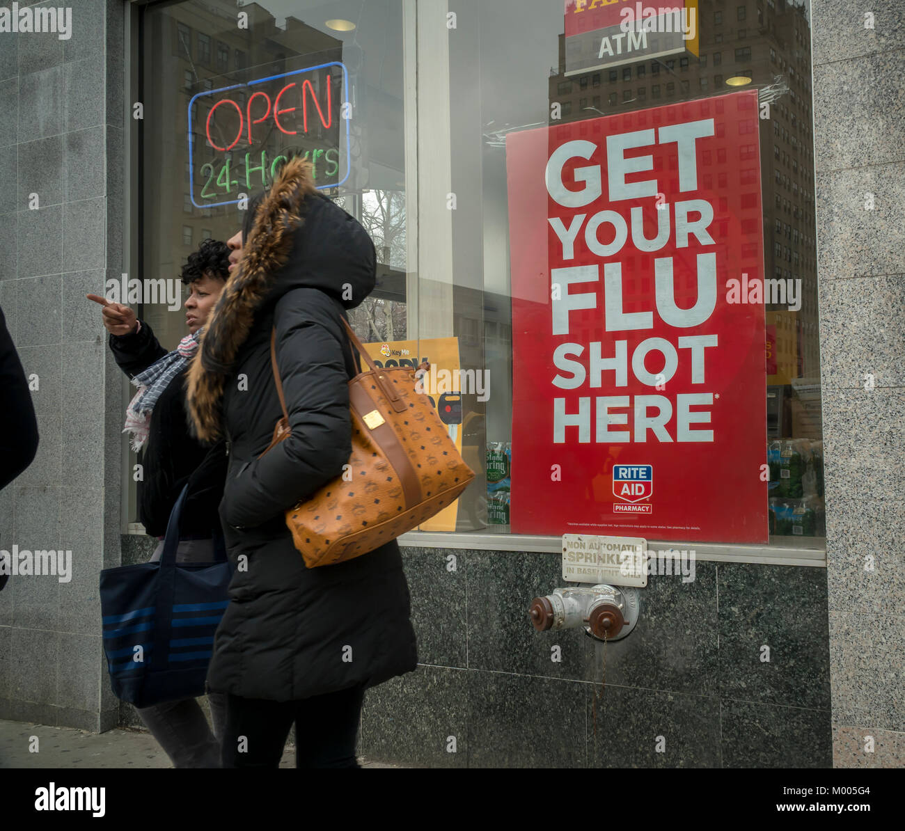 A sign advertises that flu shots are available at a Rite Aid drugstore in New York on Tuesday