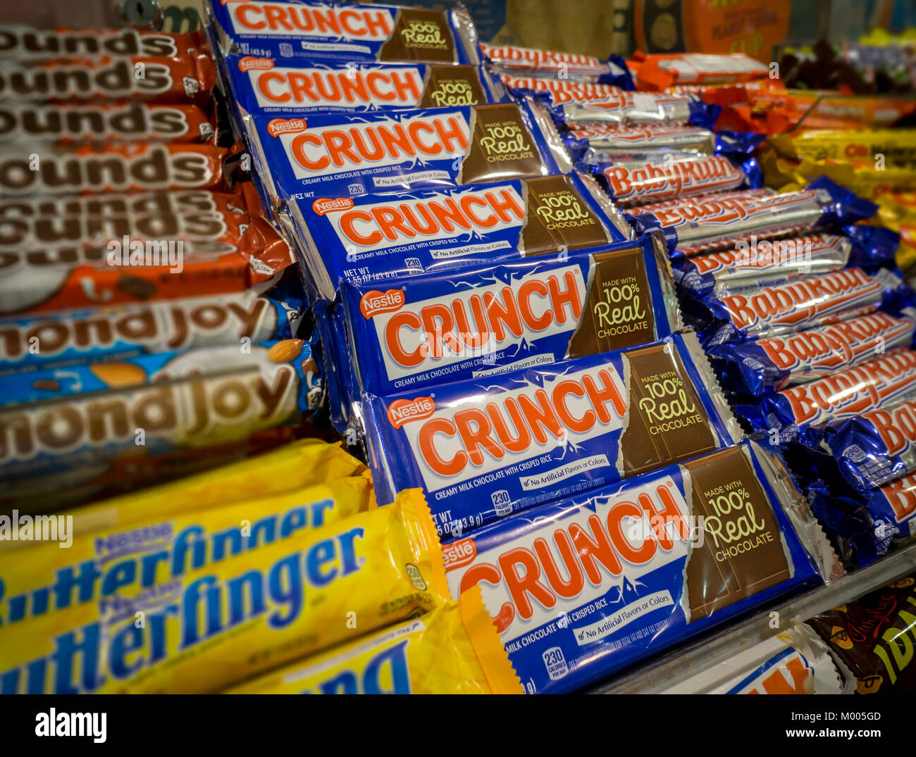 A selection of NestlÃ© brand candies among other brands on the shelves of a store in New York on Tuesday, January 16, 2018. Italian chocolatier and candy manufacturer Ferrero (and maker of the wildly popular Nutella) is buying NestlÃ©'s U.S. confectionary business for approximately $2.8 billion. Ferrero will now become the third-largest candy maker in the U.S. behind The Hershey Co. and Mars. (Â© Richard B. Levine) Stock Photo