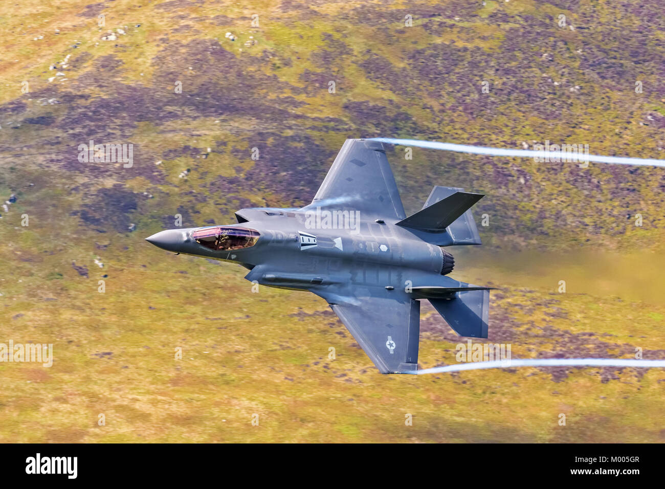 Lockheed Martin F-35 Lightning II flying low level in the mach loop Wales UK Stock Photo