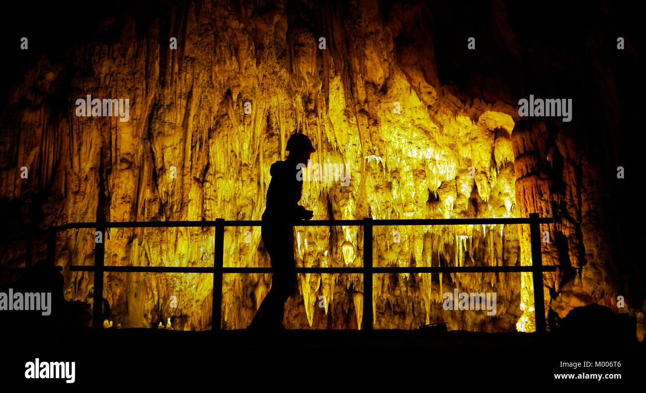 silhouette of a tourist visiting the Spilja Vranjaca show cave cavern in Bistricka ulica 19 Kotlenice Croatia Stock Photo