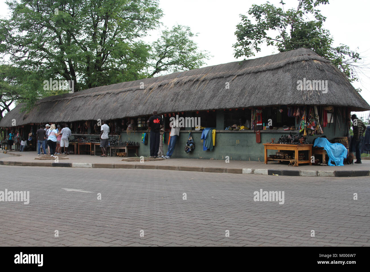 Gift and souvenir shops centre with thatch roof, Mosi-Oa-Tunya, Victoria Falls, Zimbabwe. Stock Photo