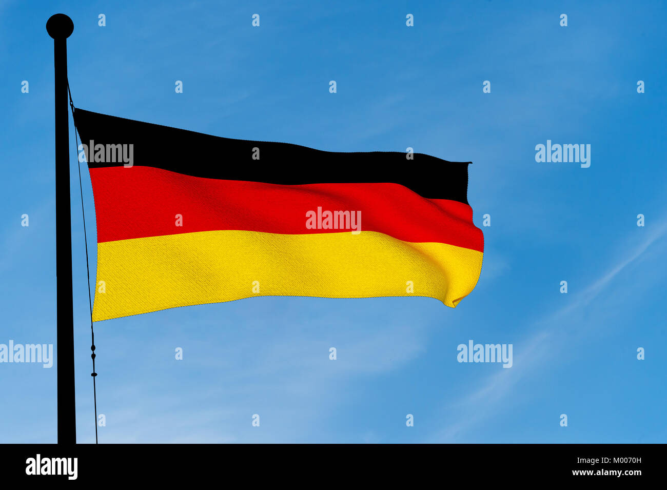 German Flag waving over blue sky (3D rendering) Stock Photo