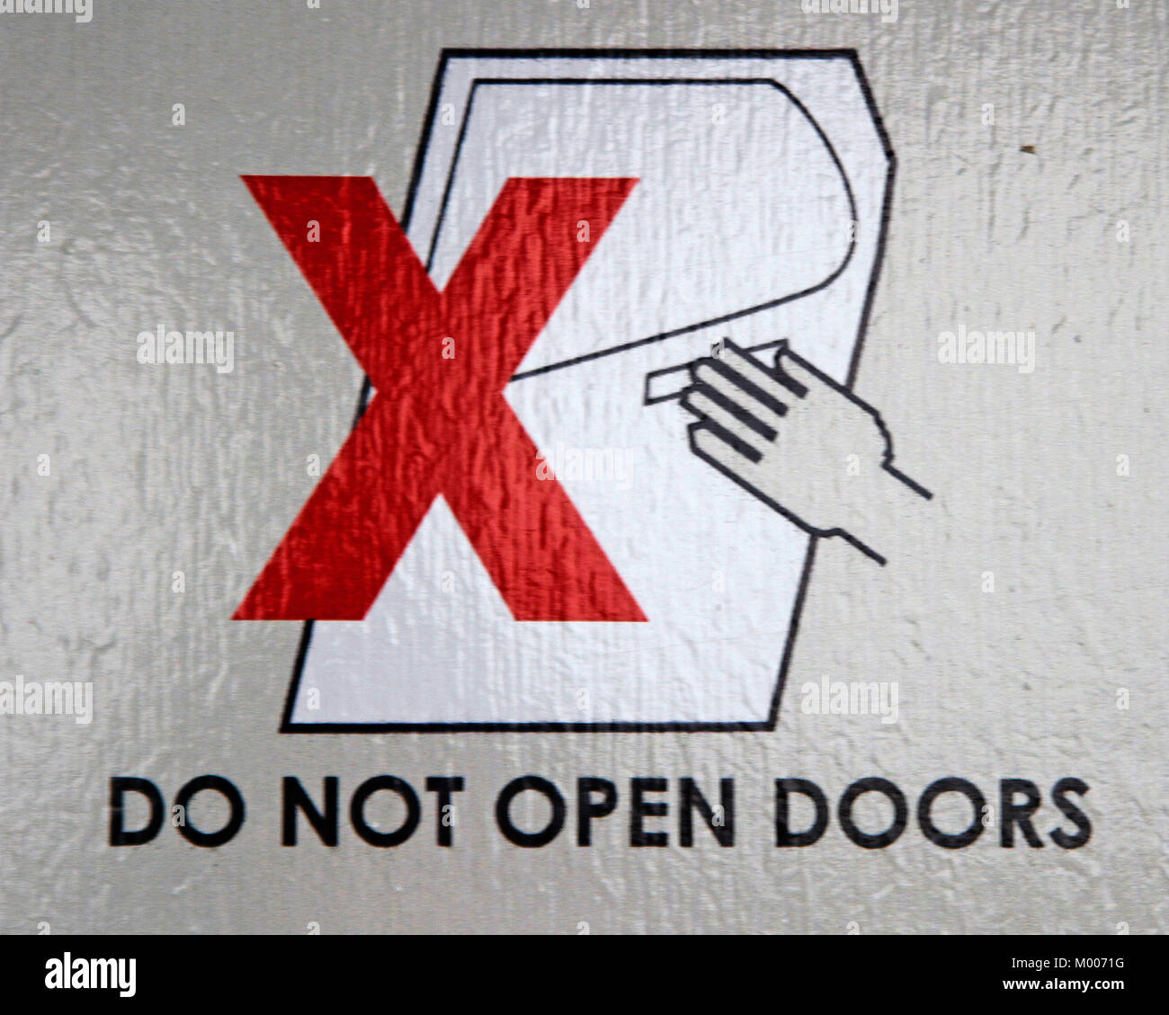 Do not open doors safety sign in Zambezi Helicopter Company's Bell 206L3 LongRanger III, Mosi