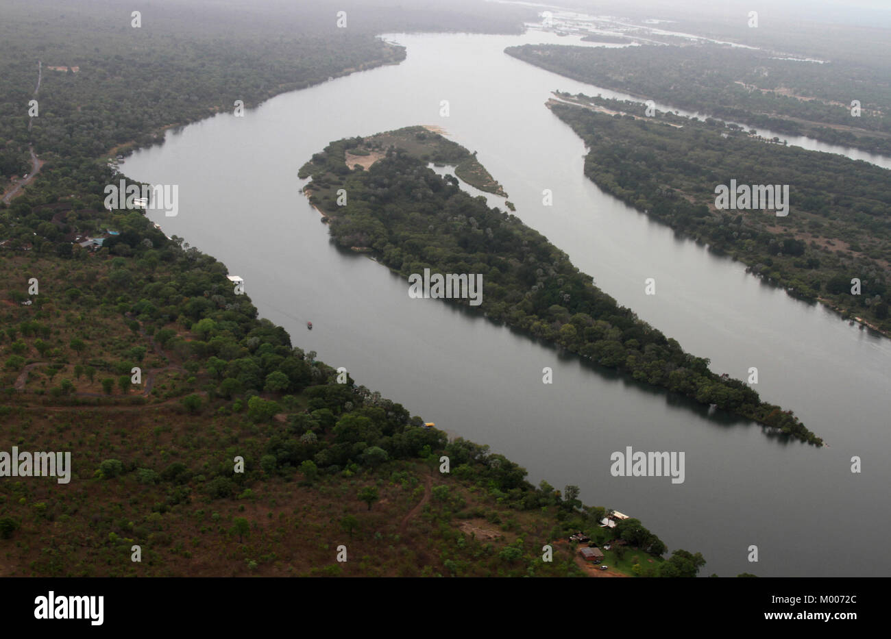 Aerial view of a small island on the Zambezi River seperating Zambia from Zimbabwe, Mosi-Oa-Tunya, Victoria Falls, Zimbabwe. Stock Photo